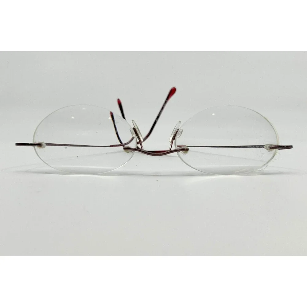 Dollar Optical Eyeglasses Unisex Red Beta Titanium Rimless Oval BT 2000 150